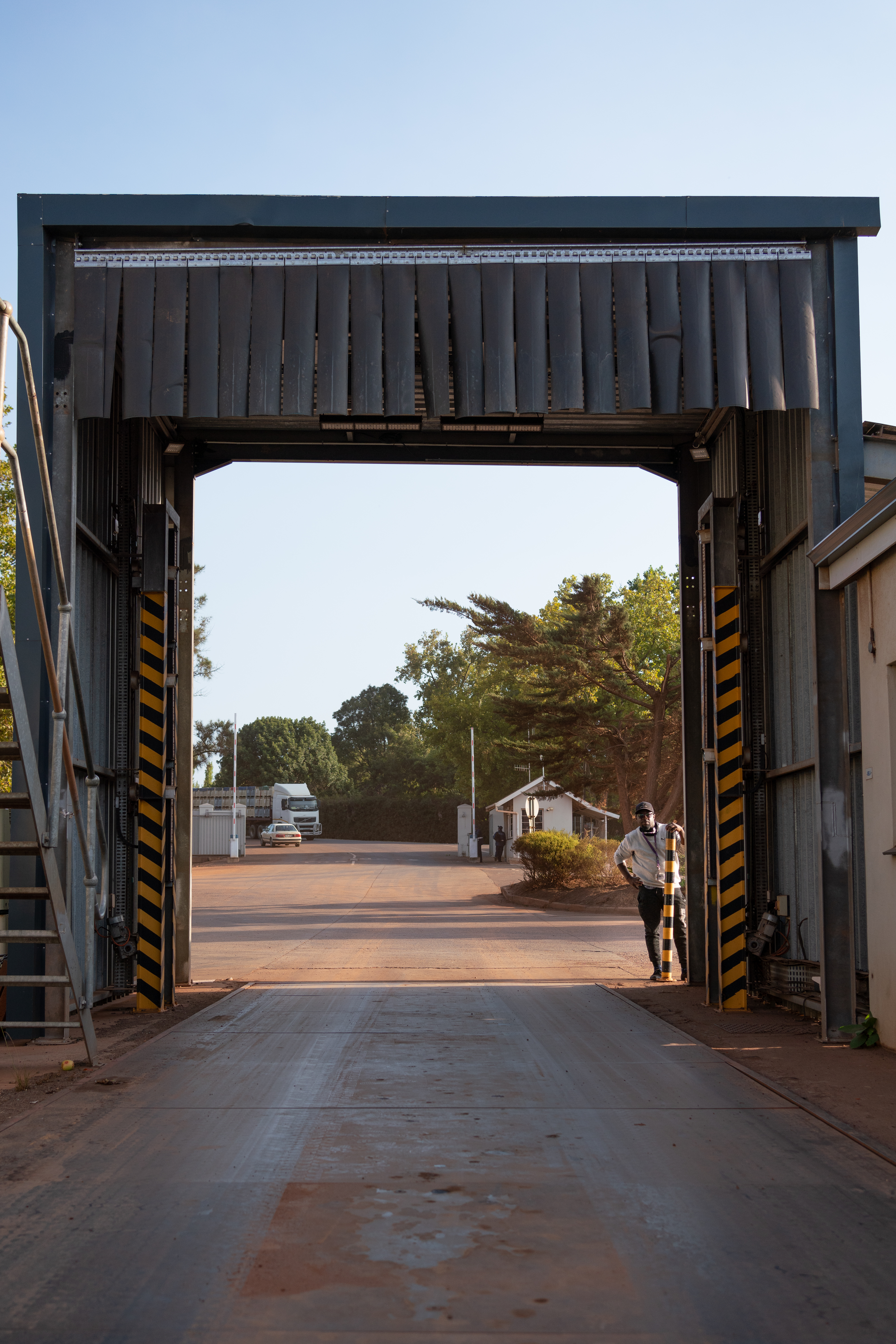 Truck at Two-A-Day's facility beginning to pass through the Croptracker overhead scanning system