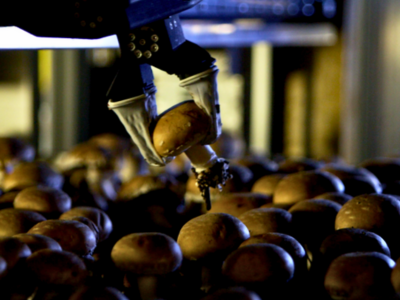 Mycionics' automated harvester delicately picks a mushroom with a claw like grip